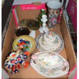 A box of decorative pottery and some glass sweets