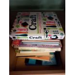 A box of books relating to craft