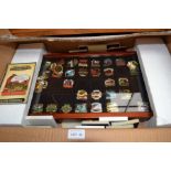 A boxed and cased railway pin badge collection