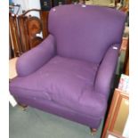 A modern armchair in purple upholstery