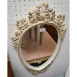 A Marie Antionette style carved mirror