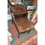 A two tier dark wood telephone table