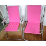 A pair of folding garden chairs