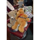 Two teddy Bears a tartan dog and a sheepskin rug