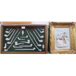 A framed clay pipe collection plus a continental porcelain 3-d plaque