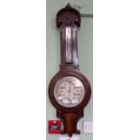 A Victorian wall hanging thermometer barometer