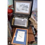 A cased Olympia typewriter, a Roberts radio and two decorative prints