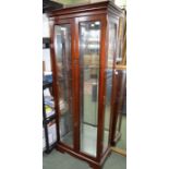 A large two door glass display cabinet