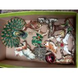 A box of decorative metal ornamental animals