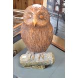 A stone perched owl