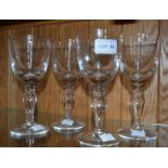 A set of four good quality heavy stemmed wine glasses