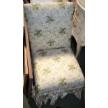 A small upholstered easy chair