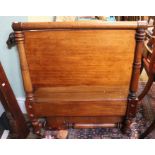 A late 19th / early 20th century mahogany framed single bed, the solid head & foot board having pila