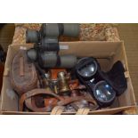 A box containing a good selection of binoculars, some cased
