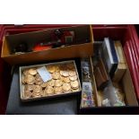A crate containing a small selection of collectors coinage & various useful domestic items, to inclu