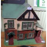 A small vintage dolls house