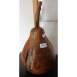 A large carved fruitwood example of a pear