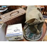 A small wicker basket, canvas tackle bag, both full of tackle with a Gladding surfcast reel and