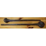 Two 20th Century carved wood African clubs 64 cm longest