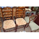 A pair of Victorian fancy backed single chairs, together with two ladder backed single chair