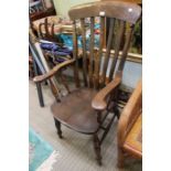 A late 19th early 20th century slat back country kitchen armchair 101 cm high