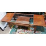 A retro long & low wooden coffee table with glass insert top & magazine undertier