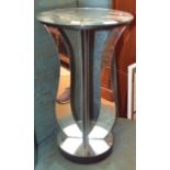 A modern glass mirror effect side table