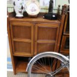 A late 19th/early 20th century mahogany side cabinet with decorative 3/4 pierced upstand with four t