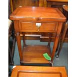 A modern mahogany coloured lamp table with single drawer and a solid under tier