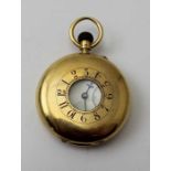 An 18ct gold half hunter pocket watch, the dial with Arabic numerals, and secondary dial, inner dust