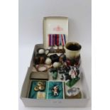A collection of miscellaneous items includes; WWII medals, carved stone animals, cast & panted lead