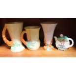 Clarice Cliff floral tea pot plus two "Bizarre" pattern jugs and another jug