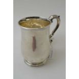 Josiah Williams & Co. A silver flared body tankard, London 1939, together with a baluster form silve