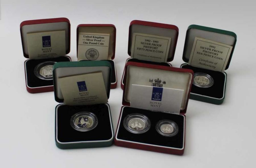 A collection of silver proof coins in original boxes