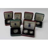 A collection of silver proof coins in original boxes