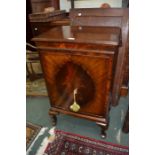 A 20th century Waring & Gillow mahogany two door music cabinet, on short cabriole legs