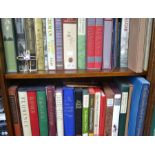 Two shelves of Folio Society books with some associated Folio literature