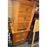 A pair of imported three drawer chests