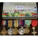 Tin containing a selection of war medals