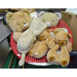 A selection of soft toys various including a pair of teddy bear slippers