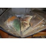 Four assorted wooden fly and tackle boxes with contents, an unhooking net and a file of fly feathers