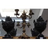 Pair decorative cast metal urns and covers with a quality cast and gilded candlestick