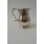 Alfred Ernest Neighbour, A Georgian design silver baluster cream jug, with sparrow beak, London 1938