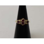 An 18ct gold ruby and diamond set ring, ring size: L1/2, gross weight: 4g