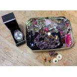 A tin of costume jewellery, to include; a large wrist watch, a 9ct gold stone set bracelet, and a Bl