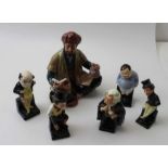 A Royal Doulton "Omar Khayyam" HN2247 figurine, together with five Doulton Dickens figures
