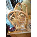 A bamboo magazine rack together with an Ercol stick back chair