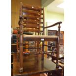 Five ladder back chairs with rush seats, three singles and two carvers