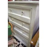 A painted softwood four drawer chest with blue and white ceramic handles