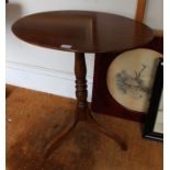A Victorian oval tilt top tripod table 69 x 64 cm